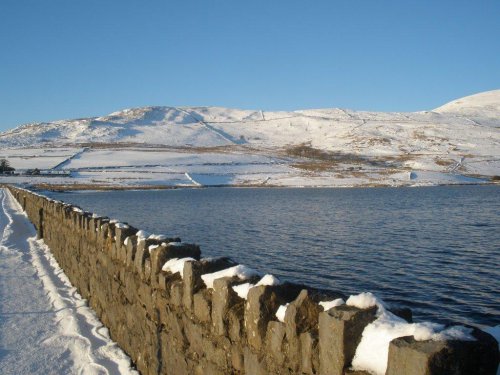 Snow on the hills from the dam at Cwmystradllyn.
